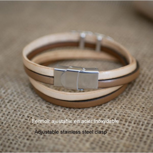 Correia dupla de couro em duo decorada com uma pena de prata